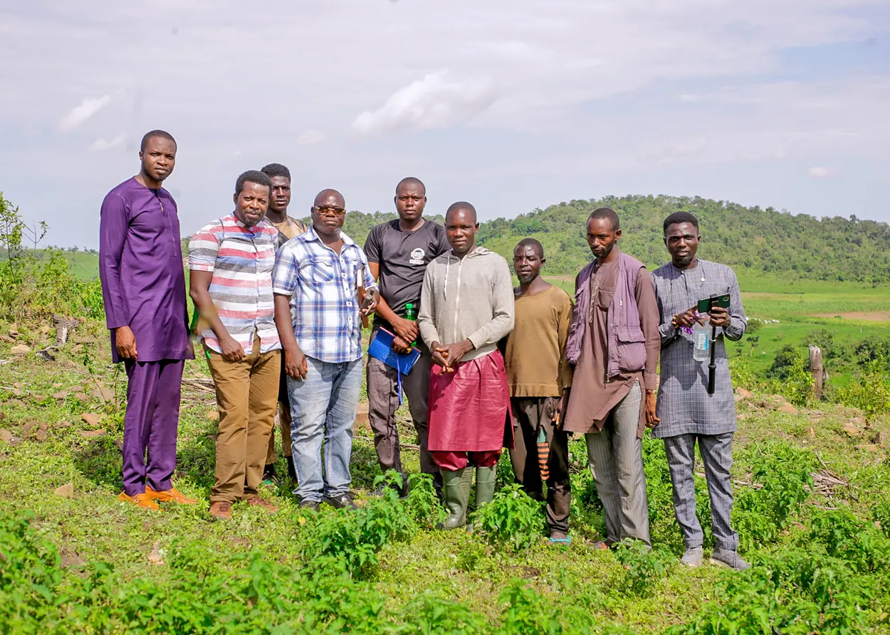 A group gathered in an outdoor field setting